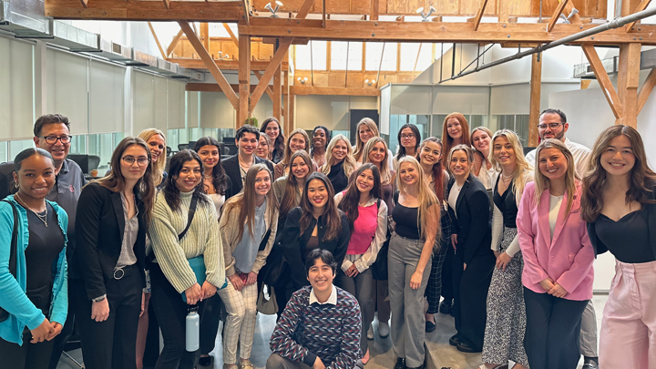 Students pose for a group shot at Allison Worldwide's Los Angeles office. Photo provided by Dr. Kaye Sweetser
