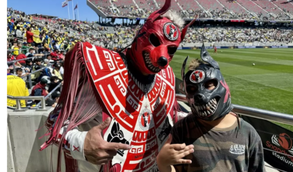 Benito Partida, aka “Xolo Perro Partida,” with his son in a friendly match at Snapdragon Stadium in San Diego. (Alexandra Mendoza/U-T)